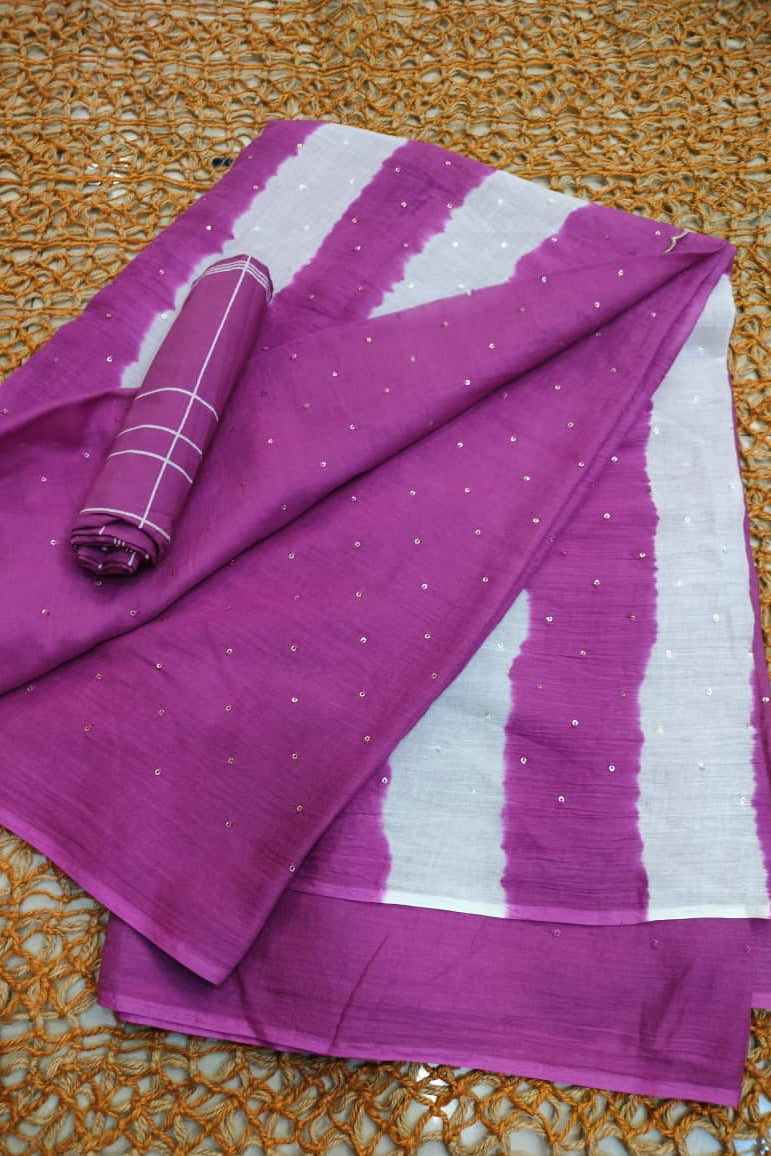 Purple and white fabric with a subtle pattern on a textured surface